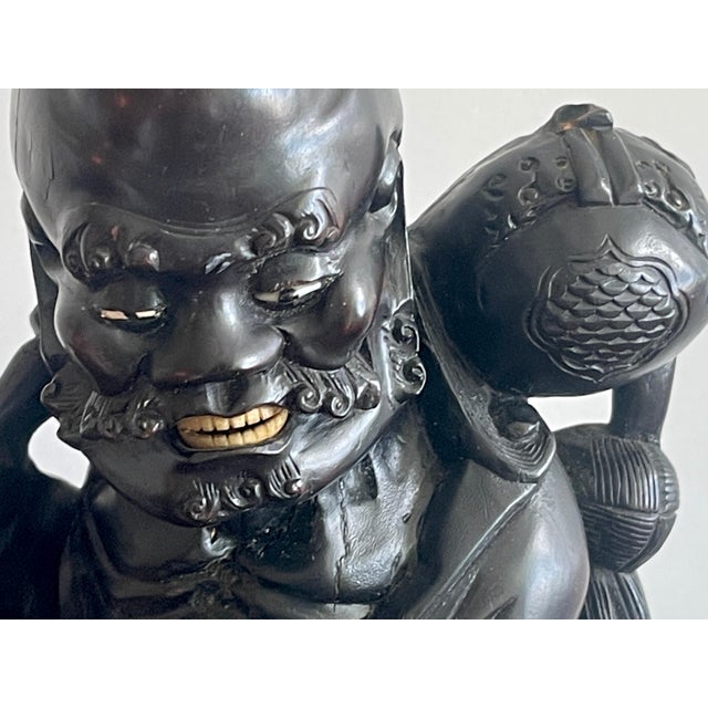 19th Chinese Carved Hardwood Figure of an Immortal Holding a Bat For Sale - Image 4 of 10