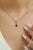 This solitaire pendant showcases a 0.7 carat pear-cut ruby, set in 14k yellow gold. The ruby measuring 6.53 x 4.5 mm,...