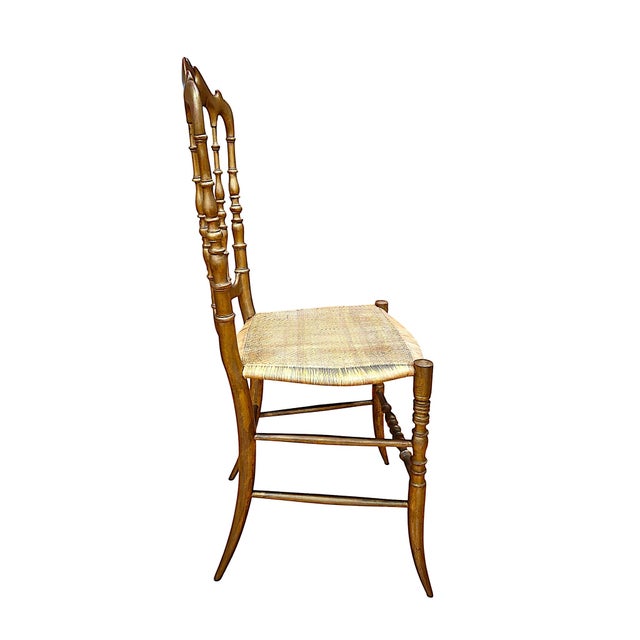 You are looking at the 20th-century “great-great granddaughter” of the classic ballroom chair. This specific design by...