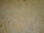 An early 20th century worn oversize antique Turkish Oushak rug in soft colors. Ivory field accents in pink, brick red,...