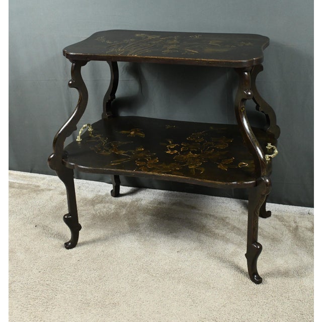 Side table with two vibrant tops with Japanese relief decorations of birds, flowers and foliage. The large lower tray is...