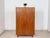 Mid-century wardrobe from the 1960s. This piece of furniture impresses with its clean lines, elegant wood grain, and...