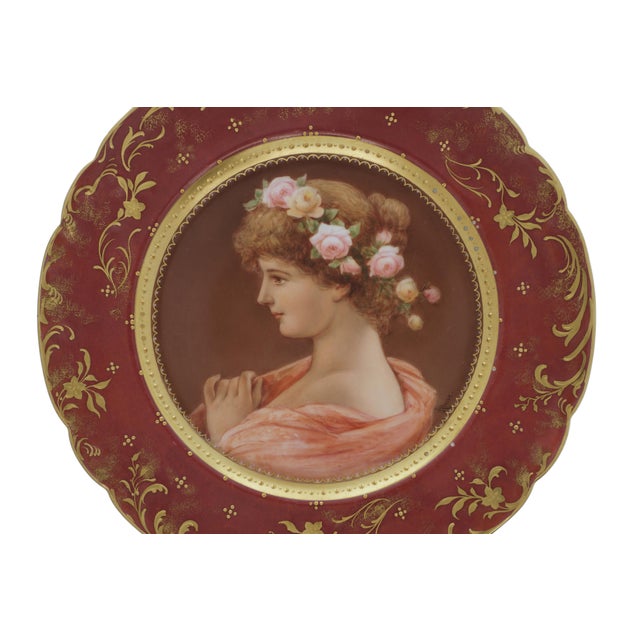 A striking Vienna-style cabinet plate featuring a romantic portrait of a young woman in profile, with roses arranged...