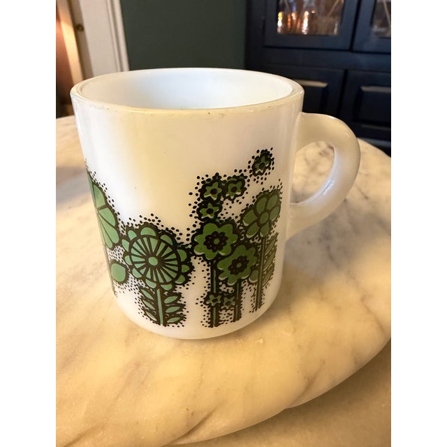 The VTG Hazel Atlas "Flower Power" Milk Glass Coffee Mugs from the 1960s are a perfect addition to any retro-loving...