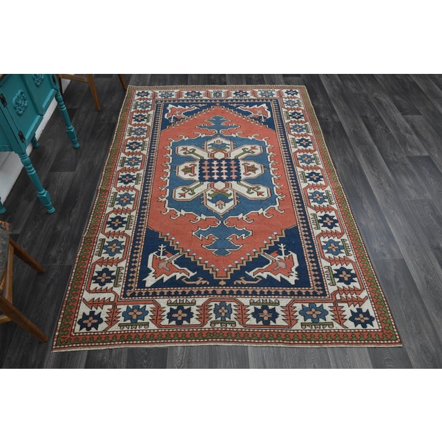 Vintage Turkish Hand-Knotted vintage rug is a semi-antique vintage area rug. The '70s Eastern region of Turkey's unique...