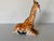 Charming vintage ceramic figurine of a seated giraffe, beautifully handcrafted and hand-painted with glossy glaze. The...
