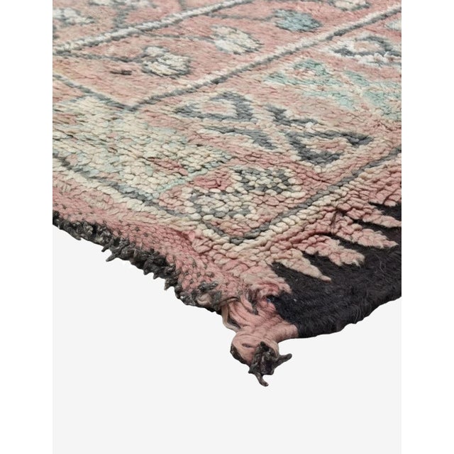 Vintage Pink Moroccan Rug | Handwoven Blush Berber Wool Rug with Floral Vine Motif This elegant vintage Moroccan rug...