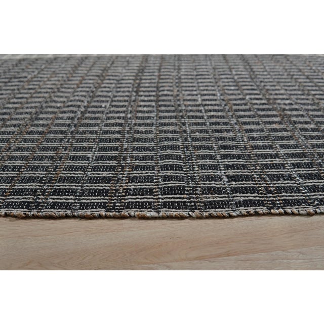 Lila Talia Gold Flatweave Rug, Country of Origin: India. This striking piece exemplifies the refined craftsmanship...