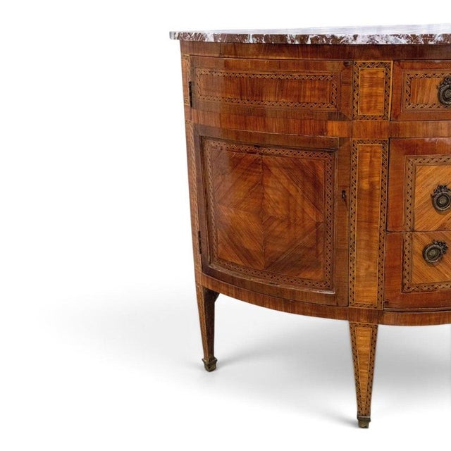 This elegant 18th-century french louis xvi demilune commode combines refined neoclassical proportions with beautifully...