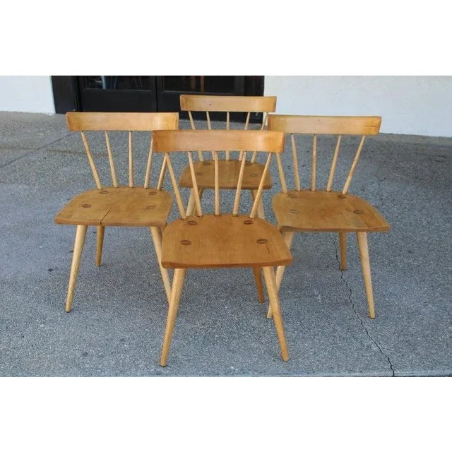 Set of four dining chairs attributed to Paul McCobb for the Winchendon Furniture (Planner Group) Co. Solid maple with a...