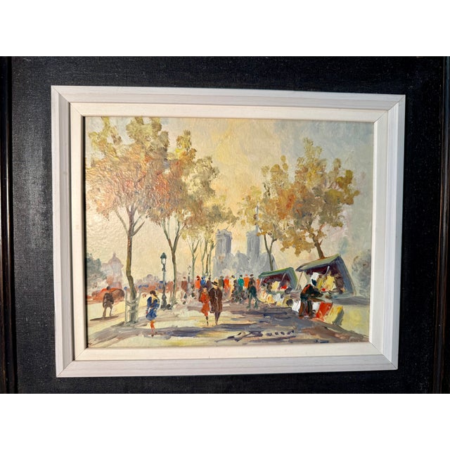 Paris! A typical beautiful scene depicting the bouquinistes, the booksellers who line the banks of the Seine and Notre...