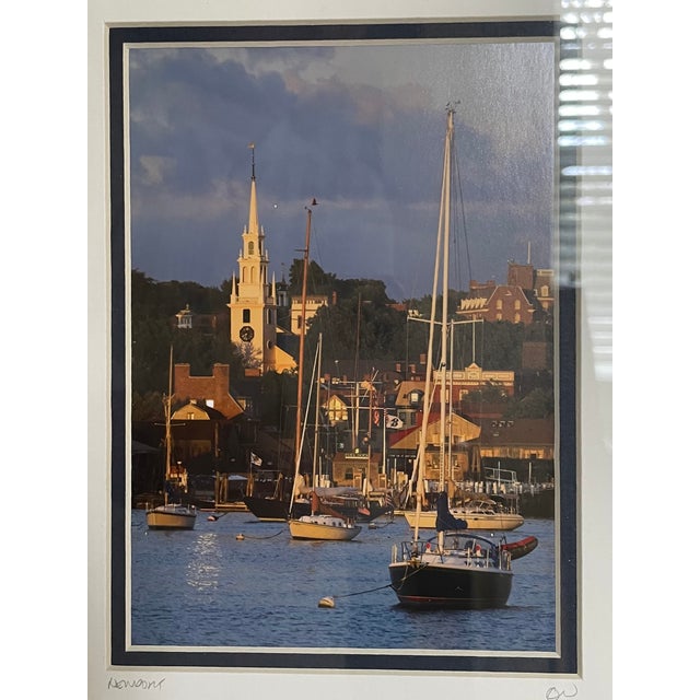 Framed photographic print of Newport harbor near Bannister Wharf with sailboats in the foreground and Trinity Church in...