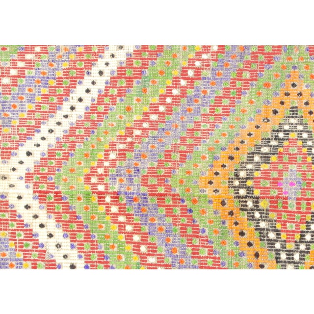 This handwoven Turkish Kilim from Oushak features a pile-free flatweave construction created by interlacing wool threads...