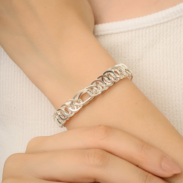 This statement-making bracelet brings a fresh, modern twist to a classic chain design. Crafted from polished 925 sterling...