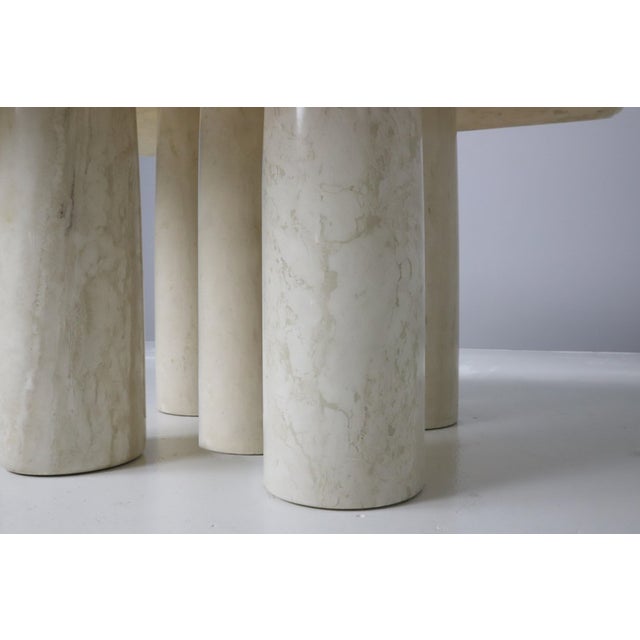 Colonnato dining table by Mario Bellini for Cassina, in travertine with a base composed of 5 columns and a 3.5 cm thick...