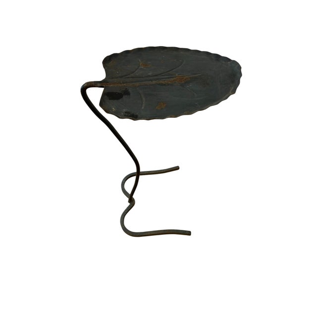 The epitome of old money style. This charming leaf shaped drink table will look fabulous on your porch or patio. It's...