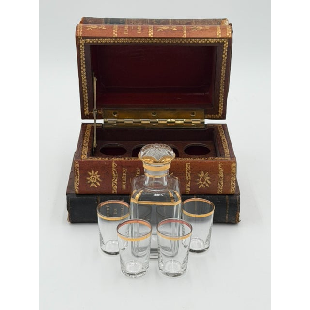 Late nineteenth-century French book-form liquor tantalus constructed from four stacked, leather-bound volumes over a...
