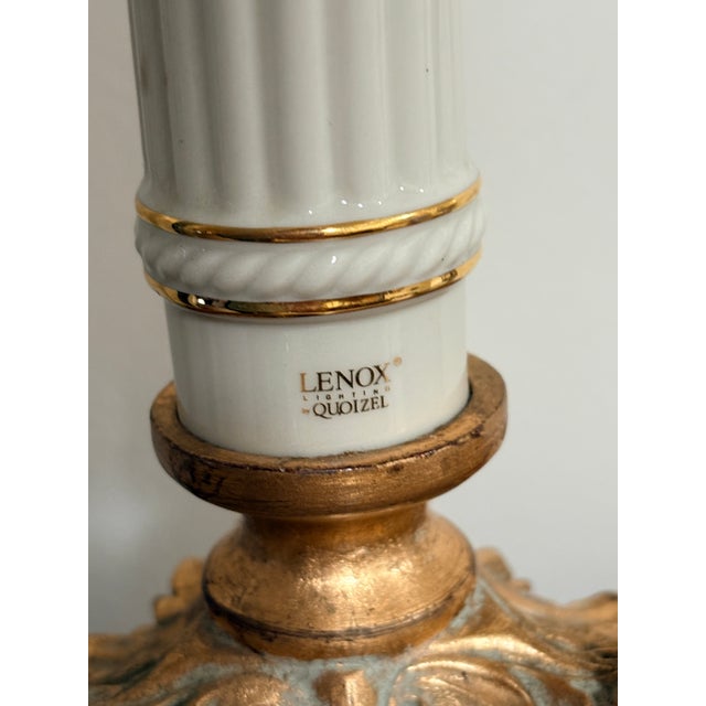 Elegant and timeless, this vintage table lamp features a beautifully crafted porcelain base attributed to Quoizel, known...
