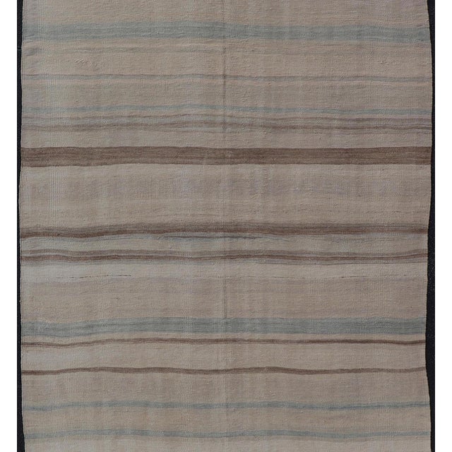 Measures: 5'10" x 11'7" Subtle Horizontal Stripe Design Turkish Vintage Kilim Rug in Warm Neutral Tones. Keivan Woven Arts...