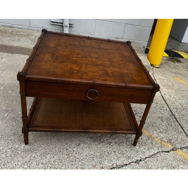 Super clean Drexel Grand Tour faux bamboo end table, Burl wood top with cane lower shelf. Single drawer with brass pull....
