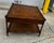 Super clean Drexel Grand Tour faux bamboo end table, Burl wood top with cane lower shelf. Single drawer with brass pull....