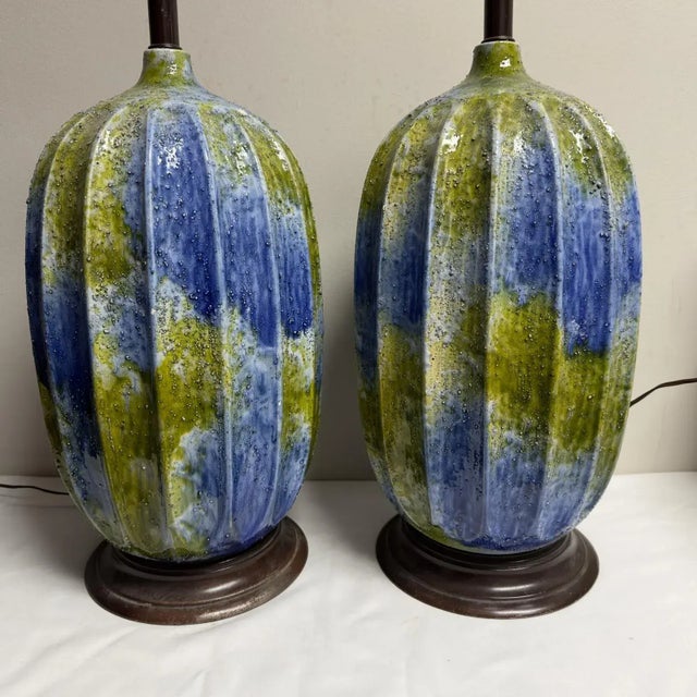 A pair of large scale Mid-Century blue and green textured ceramic lamps standing 25"H to the top of the socket x 10"...