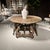 The table showcases timeless sophistication through its sculptural silhouette and finely carved detailing. The table is...