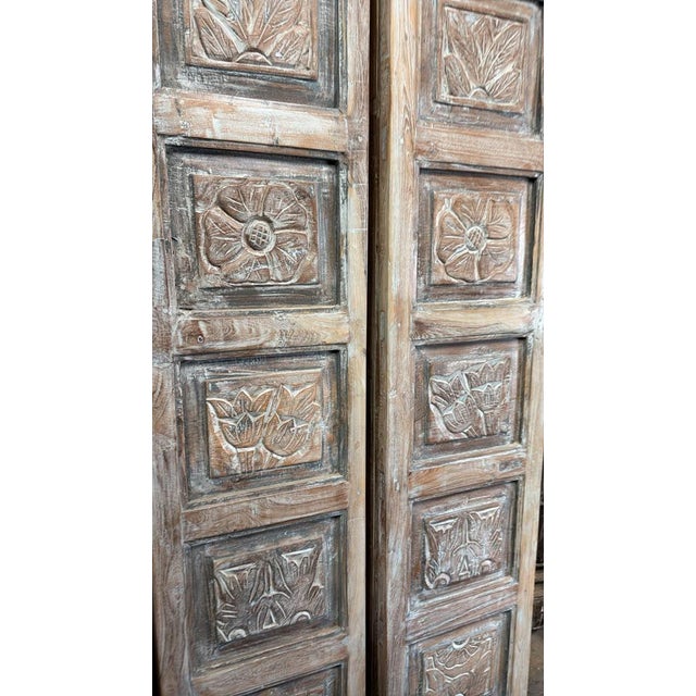 Bring timeless character and artisanal craftsmanship into your home with this stunning pair of antique hand-carved wooden...