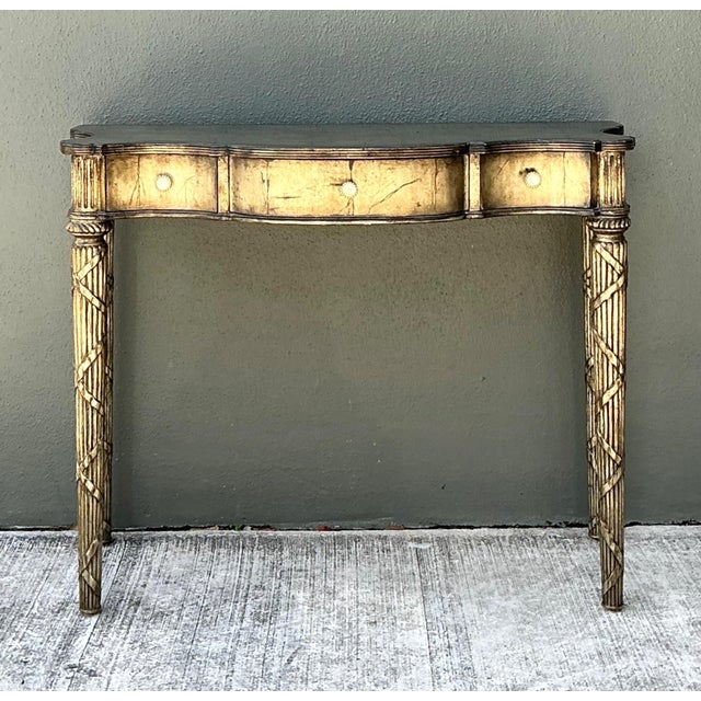 This vintage Maitland-Smith console table showcases the brand's renowned craftsmanship and refined decorative aesthetic....