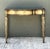 This vintage Maitland-Smith console table showcases the brand's renowned craftsmanship and refined decorative aesthetic....