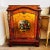 Richly decorated, this French Louis XV-style Cabinet from the mid-century is a stunning piece of furniture with intricate...