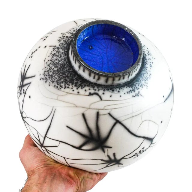 Bowl L is made of ceramic using the Naked Raku and Raku technique. The Bowl is created entirely by hand and is finished on...