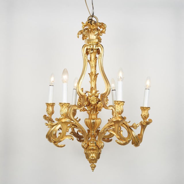A gilt bronze chandelier in the louis xv style, highly decorative, 19th century, napoleon iii period. A large gilt bronze...