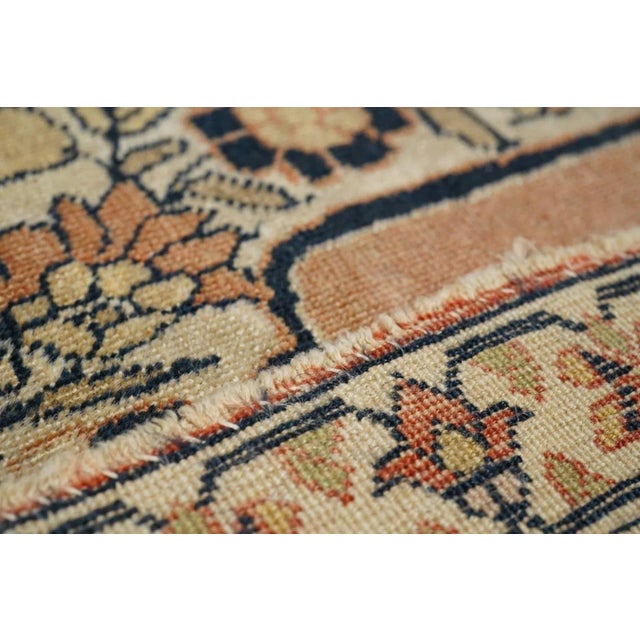 Ascribed to the famous "Hajji Jalili" workshop and definitely in its style, with an open salmon-rust sub-field supporting...