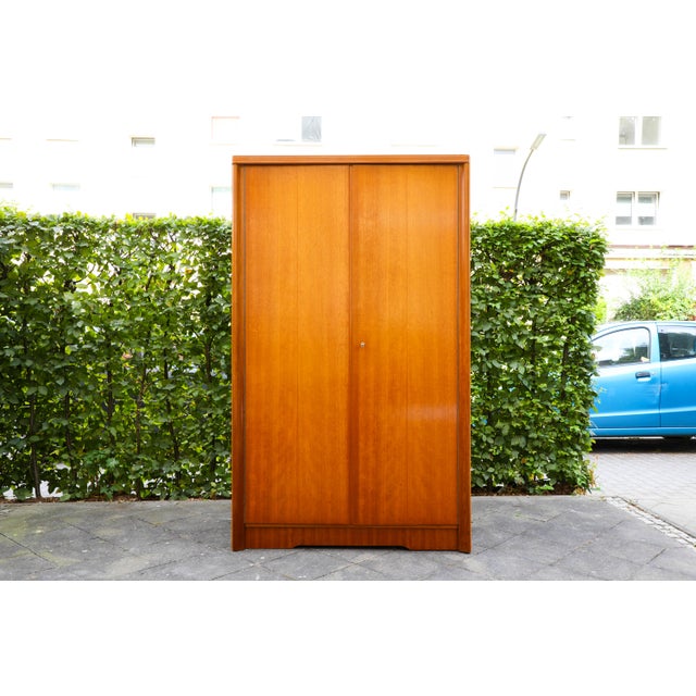Vintage Wardrobe from Musterring International, 1960s, in Very Good conditions. Designed 1960 to 1969 This piece has an...