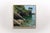 This oil on panel artwork captures the serene beauty of a cove in Cornwall, bathed in the gentle light of the afternoon....