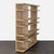 This West Elm bookshelf features a clean, modern look with a natural wood finish. The open shelving design provides plenty...