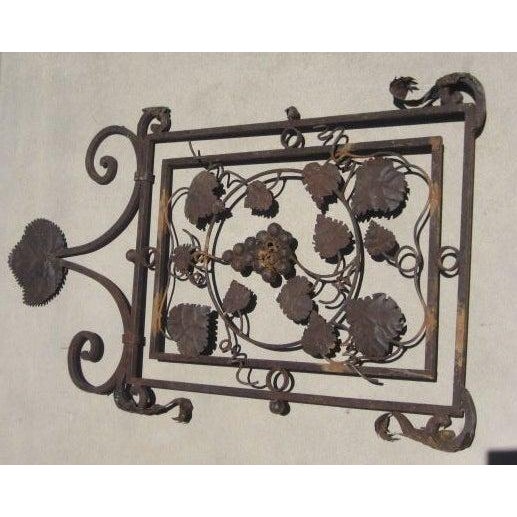 Iron side panel from a lantern with beautiful grapevine and leaf details.