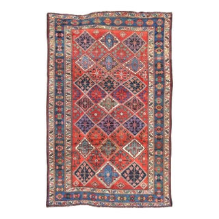 1920s Antique Persian Qashqai Rug With Tulips, Diamond Patterns and Star Motifs For Sale