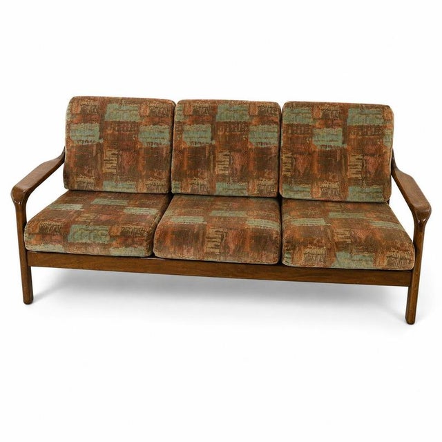 Vintage 3-Seater Sofa with Teak Frame from the 1960s This beautiful vintage 3-seater sofa from the 1960s combines an...
