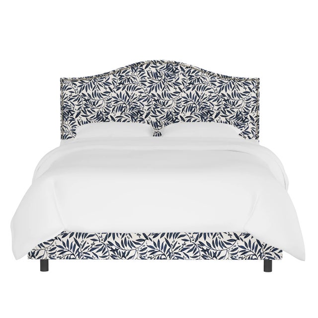 Give your interior a lift with the Bed. Featuring the delicate curves of a classic camelback design, with subtle nailhead...