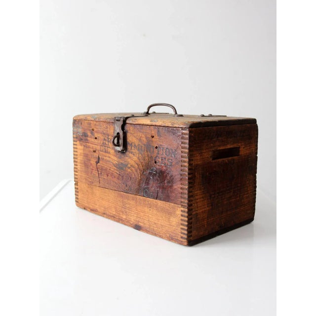 An early 20th-century Winchester ammunition box once used for storing shotgun cartridges. The dovetailed wooden crate...