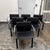 Design Plus Gallery presents a Set of Six Gekko Conference Armchairs, from Zuo Modern. Each chair has a padded black faux...