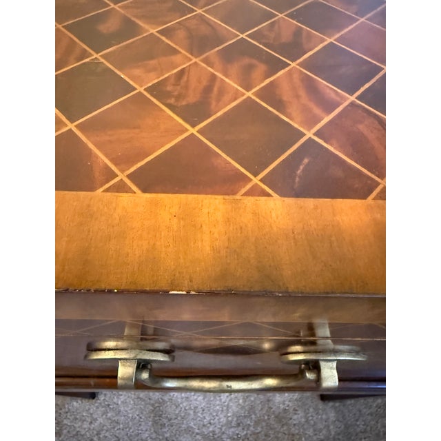 This Maitland-Smith cube-shaped box table features a meticulously applied harlequin parquetry pattern composed of rich,...