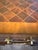 This Maitland-Smith cube-shaped box table features a meticulously applied harlequin parquetry pattern composed of rich,...