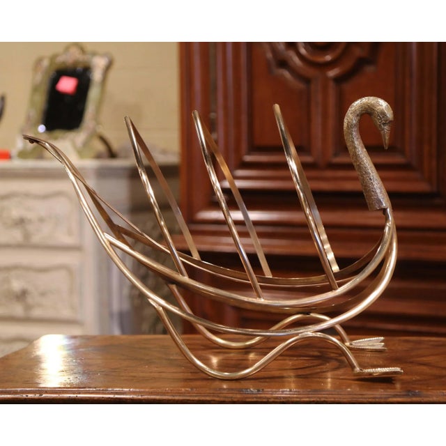 Sculptural and whimsical, this vintage brass magazine rack takes the graceful form of a swan. Crafted in France circa...