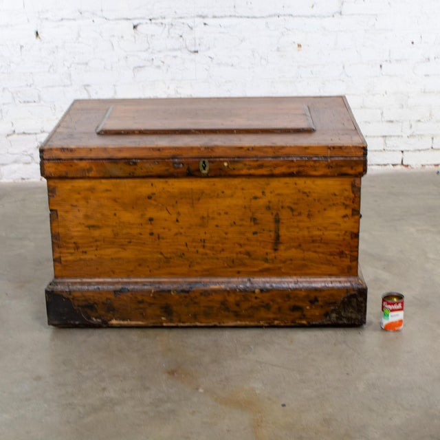 Awesome antique Colonial or Rustic pine carpenter’s tool chest, trunk, or coffee table composed of a solid pine frame with...