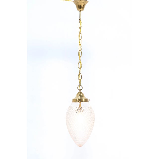 Stunning and rare Art Nouveau hall light or pendant. Striking French design from around 1915. Brass with original beveled...