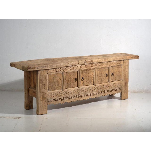 Antique carved low sideboard in pine wood, Chinese provincial furniture originating from Xinjiang and dated circa 1900....