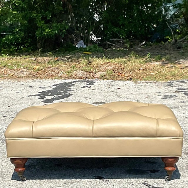 A fantastic vintage tufted leather ottoman, use it as a coffee table and put your feet on it. Acquired at a Palm Beach...